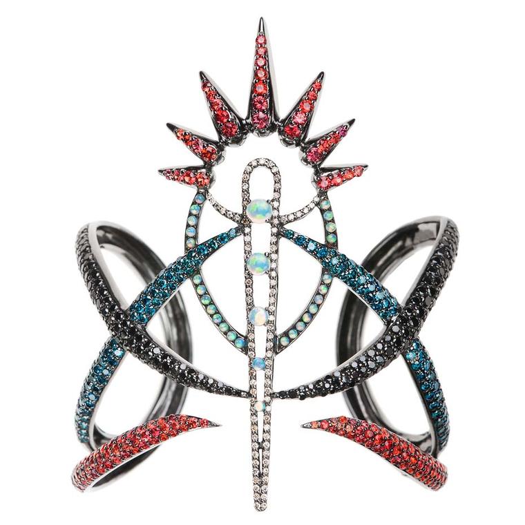 Nikos Koulis' Spectrum cuff is spiky and sexy and ablaze with colourful gemstones, including opals, black diamonds and orange sapphires.